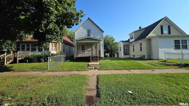 view of front of house featuring a front yard and covered porch