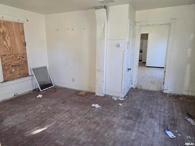 spare room with dark wood-type flooring