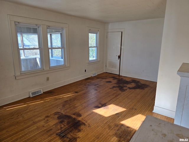 unfurnished room featuring dark hardwood / wood-style flooring