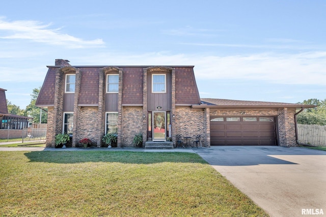 view of front facade featuring a garage and a front lawn