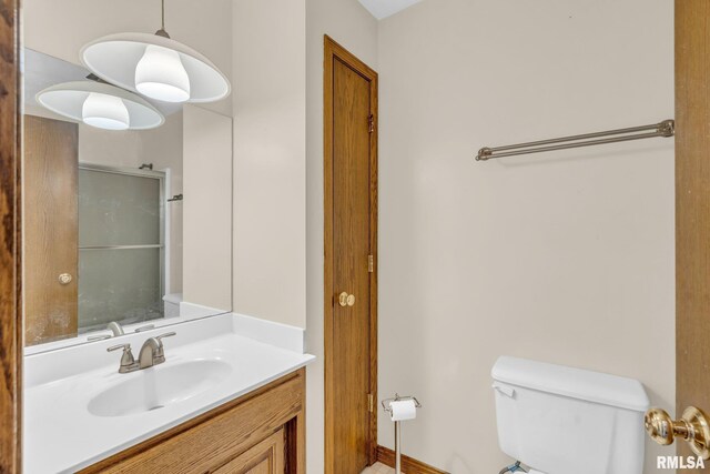 107 Hilltop St, Colona, IL 61241 - full bath featuring toilet, a shower with door, and vanity