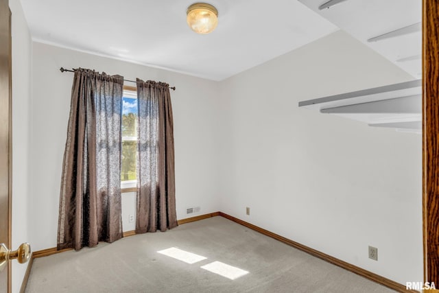 107 Hilltop St, Colona, IL 61241 - carpeted spare room with baseboards