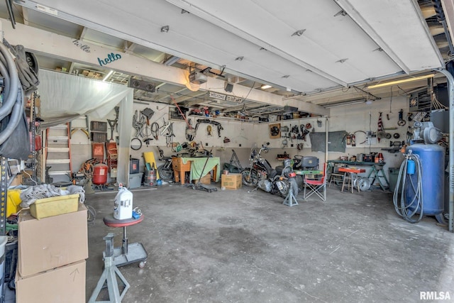 garage featuring a workshop area and a garage door opener