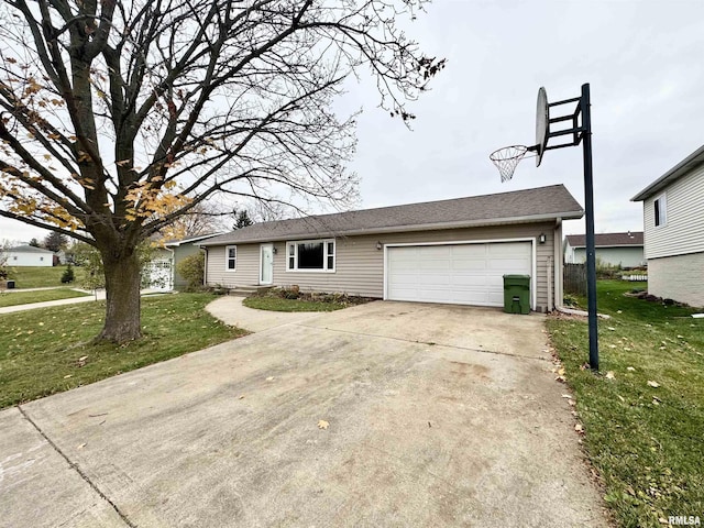 ranch-style home featuring a garage and a front lawn