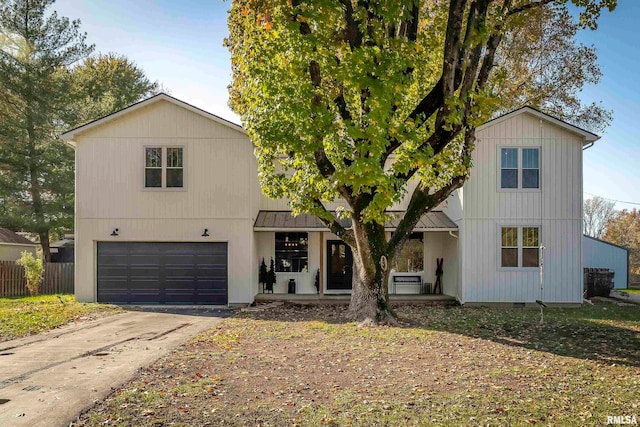 view of front of property featuring a garage and covered porch