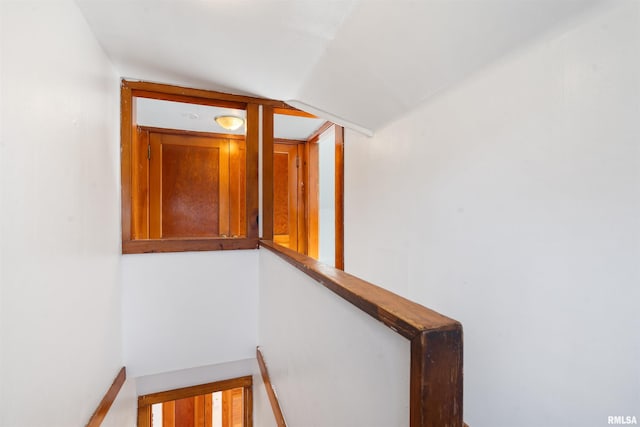 staircase with vaulted ceiling