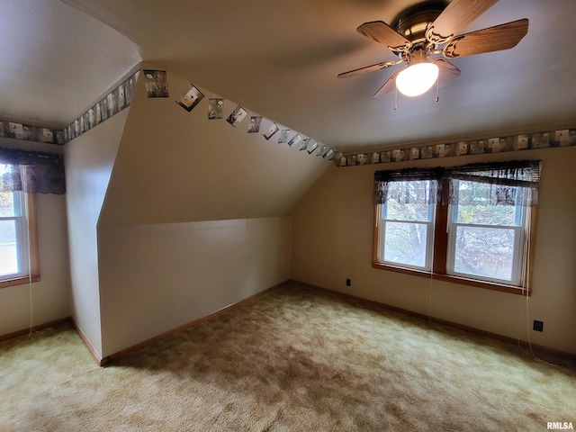 bonus room featuring vaulted ceiling, light colored carpet, and ceiling fan