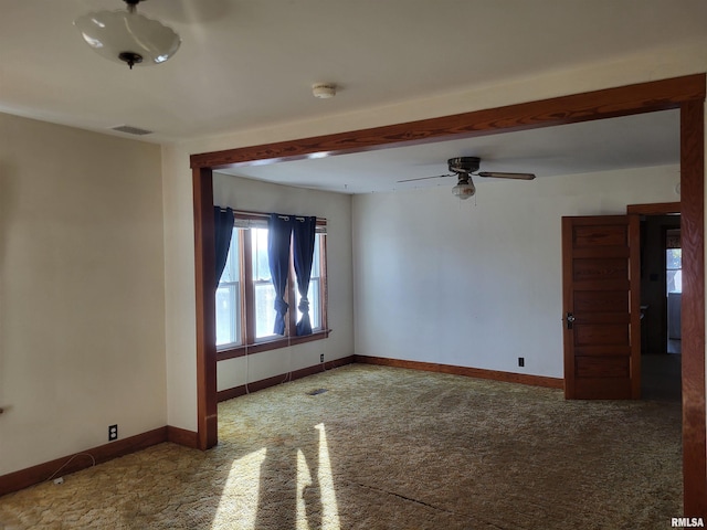 carpeted empty room featuring ceiling fan