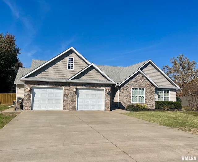 craftsman inspired home featuring a garage and a front lawn