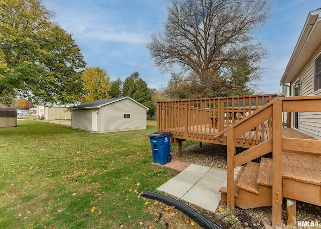 view of yard featuring an outbuilding and a deck