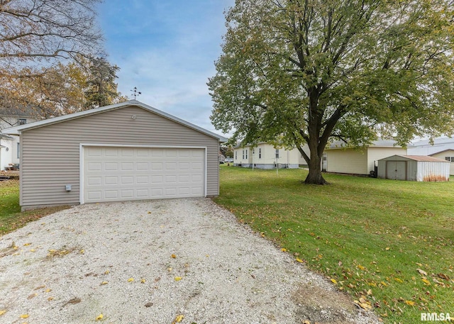 garage featuring a yard