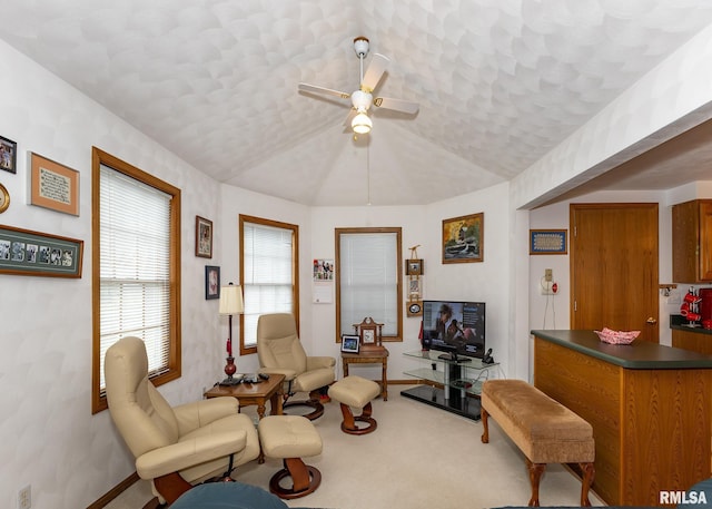 living room with carpet, vaulted ceiling, and ceiling fan