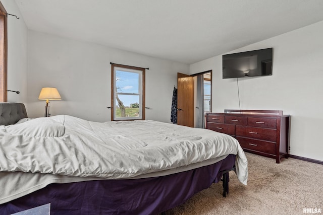 bedroom featuring light colored carpet