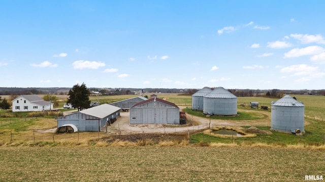 exterior space featuring a rural view and an outbuilding