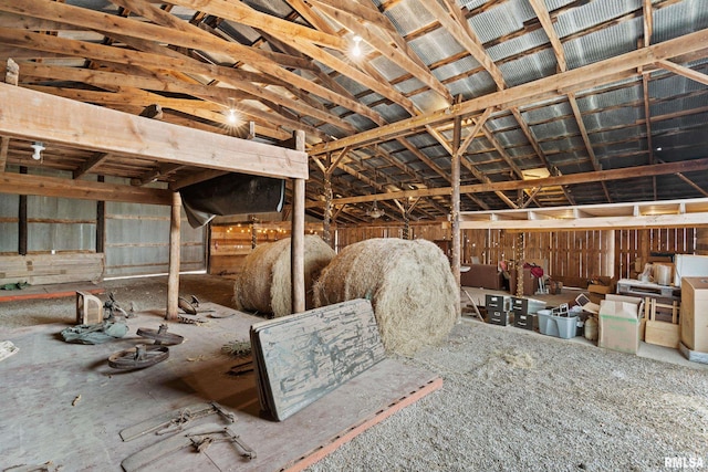 miscellaneous room with lofted ceiling