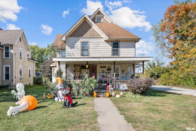 view of front of property featuring a porch and a front lawn