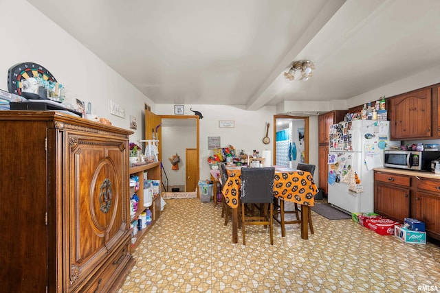 dining room featuring beam ceiling