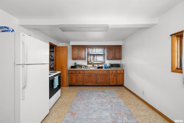 kitchen with white appliances and sink