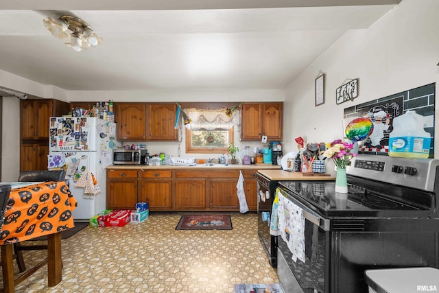 kitchen featuring sink and appliances with stainless steel finishes