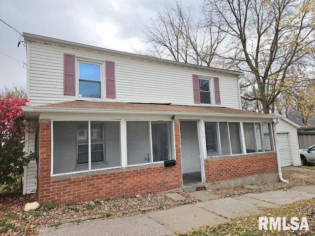 view of front of house with a sunroom