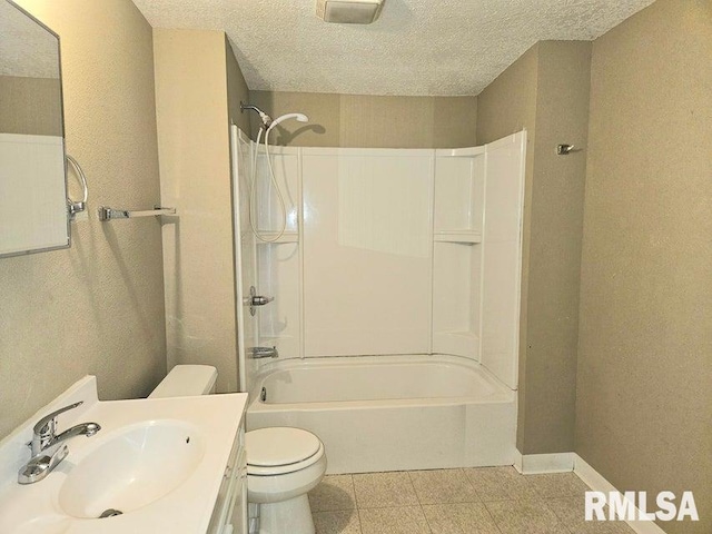 full bathroom with shower / bathing tub combination, vanity, a textured ceiling, and toilet