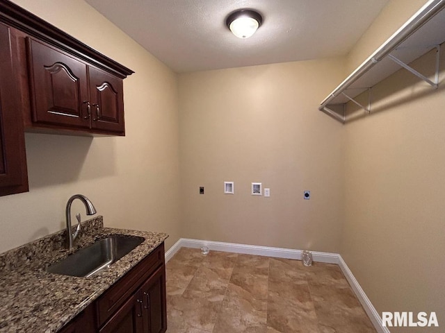 laundry area featuring hookup for a washing machine, sink, cabinets, and hookup for an electric dryer