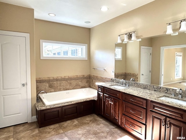 bathroom featuring a bathing tub and vanity