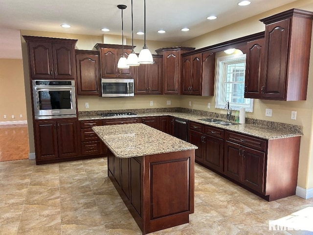 kitchen featuring a center island, sink, hanging light fixtures, dark brown cabinets, and stainless steel appliances