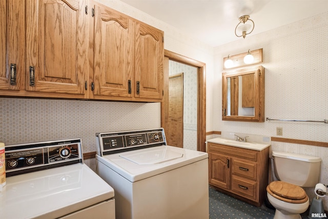 washroom featuring independent washer and dryer and sink