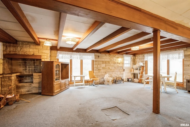 miscellaneous room featuring beam ceiling and carpet floors