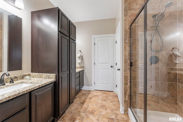 bathroom with vanity and an enclosed shower