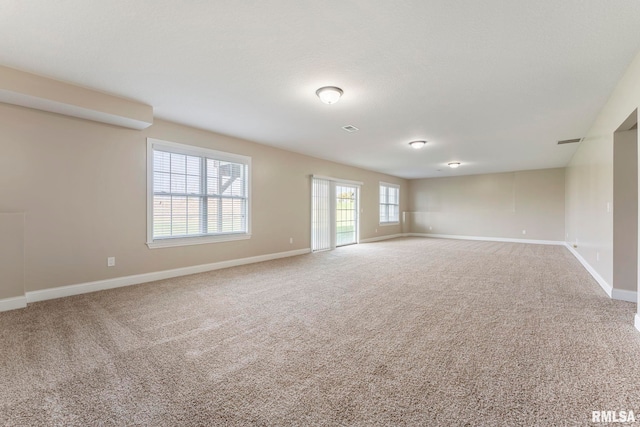 spare room with carpet floors