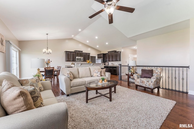 living room with ceiling fan with notable chandelier, lofted ceiling, and dark wood-type flooring