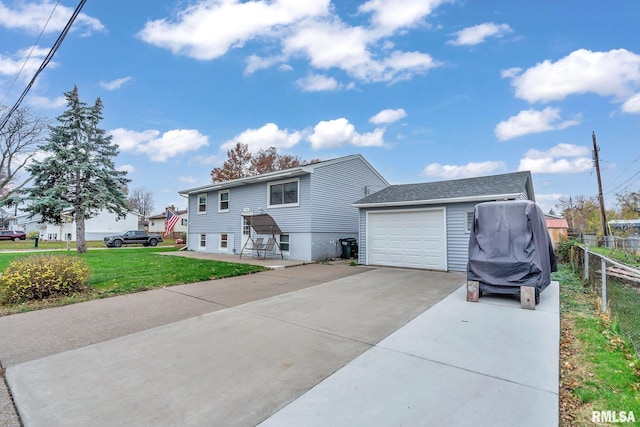 view of front of house featuring a garage and a front yard