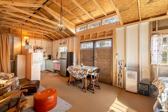 dining space with vaulted ceiling