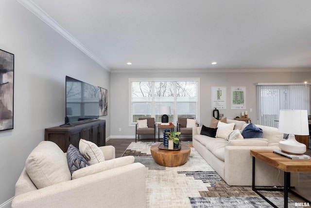 living room featuring hardwood / wood-style flooring and ornamental molding