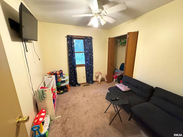 game room featuring ceiling fan and carpet