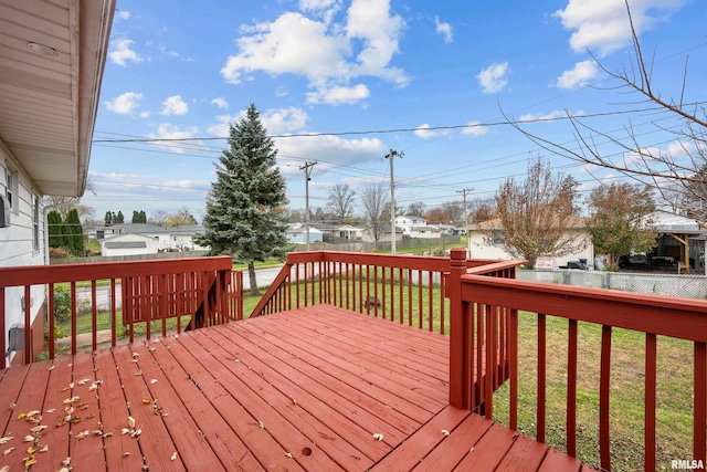 wooden terrace with a lawn