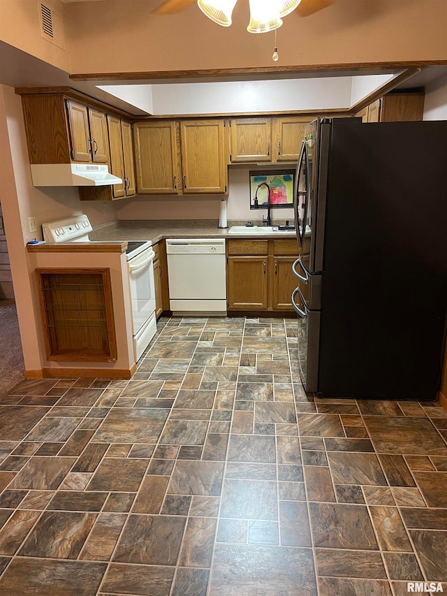 kitchen featuring sink and white appliances