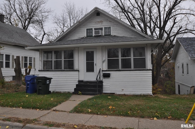 bungalow with a front lawn