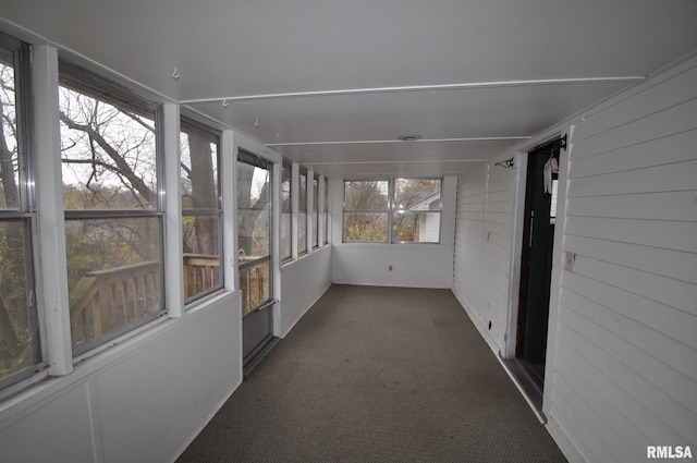 1815 Belle Ave, Davenport, IA 52803 - unfurnished sunroom featuring carpet flooring