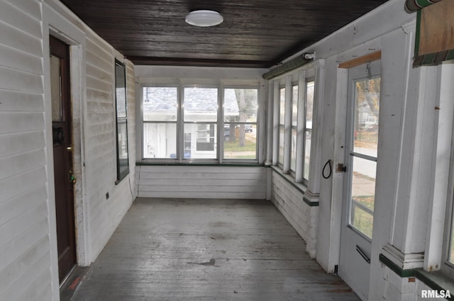 unfurnished sunroom featuring wooden ceiling