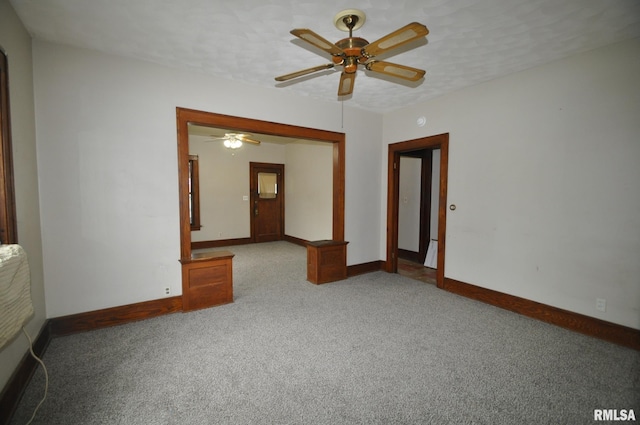 1815 Belle Ave, Davenport, IA 52803 - empty room featuring carpet floors, ceiling fan, and baseboards