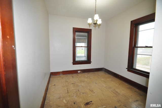 1815 Belle Ave, Davenport, IA 52803 - empty room with baseboards and healthy amount of natural light