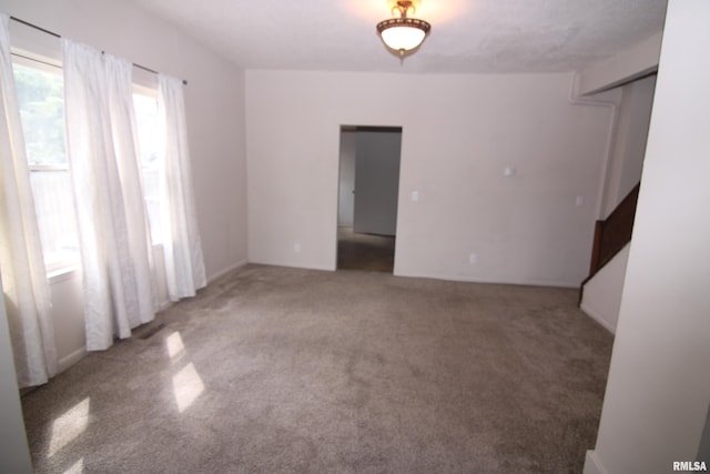 spare room featuring carpet