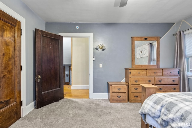 carpeted bedroom featuring ceiling fan