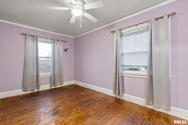 empty room featuring hardwood / wood-style floors, ceiling fan, plenty of natural light, and crown molding