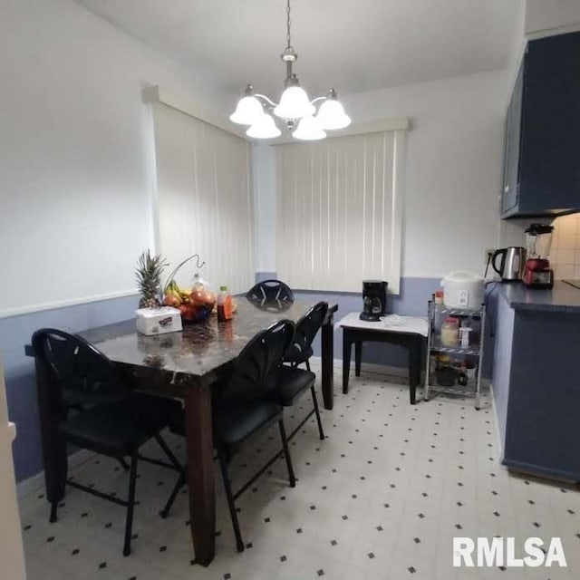 dining space featuring a chandelier