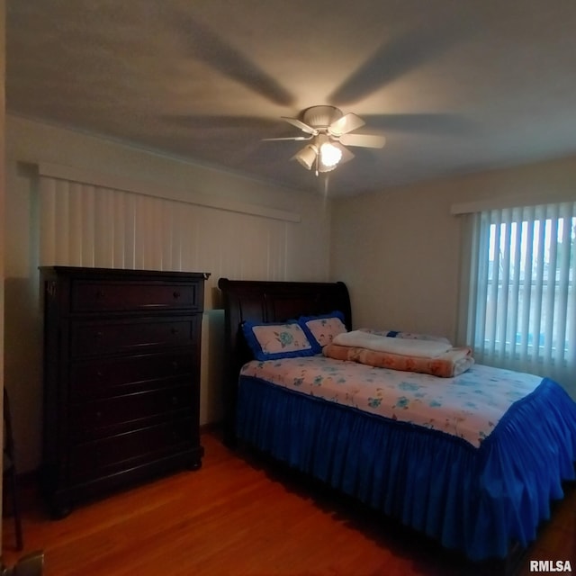 bedroom featuring hardwood / wood-style flooring and ceiling fan