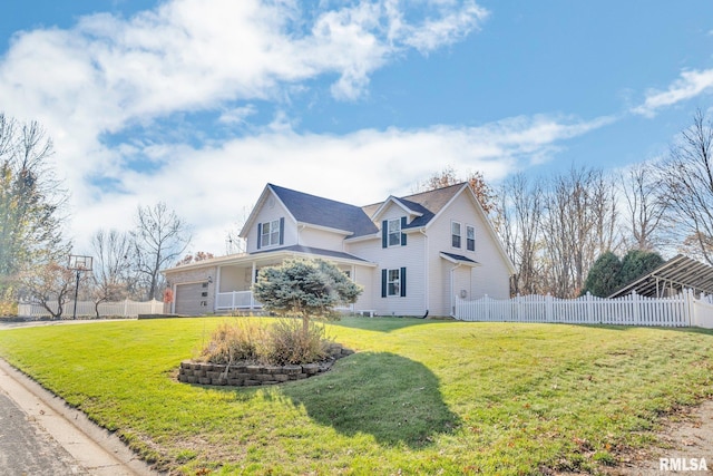 view of front of home with a front lawn and a garage